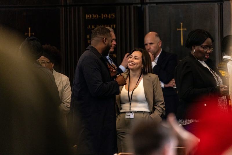 People chatting and laughing together in a church hall
