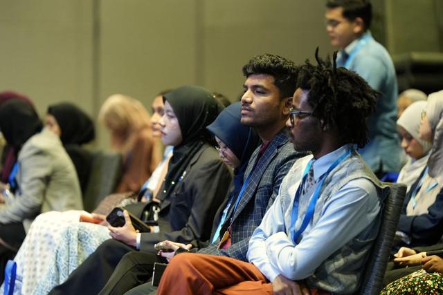 An audience at a conference