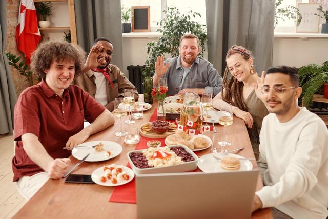 Friends around a dinner table, mid-conversation